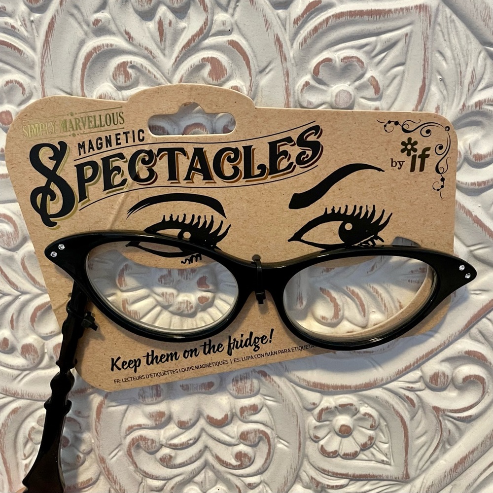 Magnifying reading glasses with built in magnets.